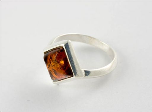 Серьги из мельхиора с янтарём 22769 купить в магазине Самоцветы мира