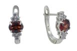 Серьги из серебра с гранатом и фианитами овал 5х7 мм 56811