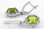 Серьги из серебра с хризолитом и фианитами овал 8х10 мм 61735